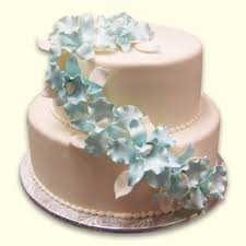 2 tier wedding cake cascading flowers. Wonderland Bakery Every Bite Is Enchanting