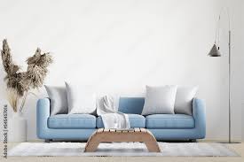 blue sofa l wooden table carpet wall