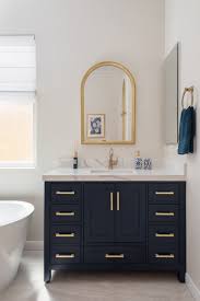 Blue Vanity With Marble Countertops And