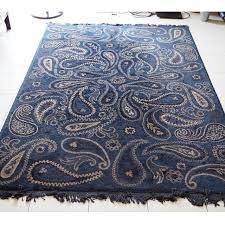 blue gold floor carpet rug with paisley