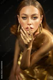 young fashion model woman with golden