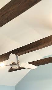 a ceiling fan from suspended faux beams