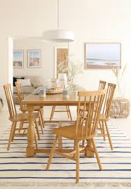 Teak or white dining furniture are favorites for this look. The New Coastal 3 Ways To Get The Beach Look At Home