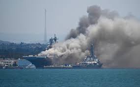 Jacob anthony chansley, known as jake angeli, is in custody on charges including violent entry and disorderly conduct. Helicopters Drop Water As Ship Continues To Burn At Naval Base San Diego Kxan Austin
