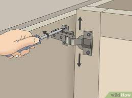 how to adjust euro style cabinet hinges
