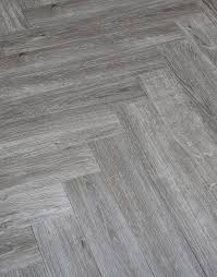 May 26, 2019 · lighter gray floors can make a room feel open and airy, while darker gray stains can visually reduce the space. Herringbone Grey Oak Lvt Flooring Flooring Superstore