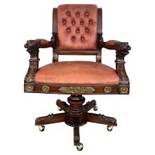 gilt garved wood lion head swivel chair