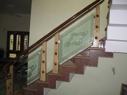 modern staircase of wood and glass railings