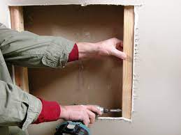 Cut out the traced area with a drywall knife, and remember. Six Ways To Fix Holes And Cracks In Drywall Hgtv