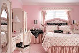 pink room with black and white polka