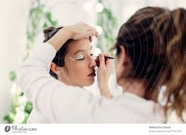 visagiste doing makeup in salon a