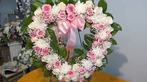 Luxury heart of pink roses a superb luxury funeral flower tribute in the shape of a heart with a combination of sweet avalanche and aqua pink roses. How To Make Open Heart Sympathy Arrangement Youtube