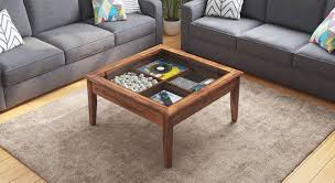 Use a spray adhesive to coat the back of the photos and adhere them to the table top. Tate Display Coffee Table Urban Ladder