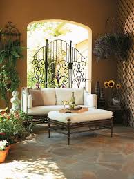 Patio With Ornate Gate And Outdoor Sofa