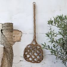 chic antique old style carpet beater of rattan