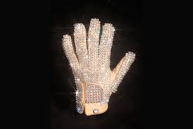 Image result for 1991 - The white crystal-beaded glove worn by Michael Jackson was stolen from the Motown Museum in Detroit. M.C. Hammer offered a $50,000 reward for its return