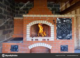 fire lit summer brick oven barbecue