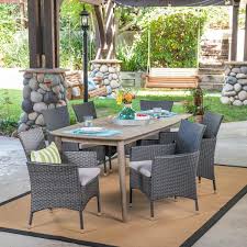 Wood And Faux Rattan Outdoor Dining Set