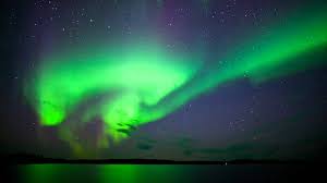 The northern lights (aurora borealis) put on a display above the snowy landscape of vee lake, northwest territories, canada. See The Northern Lights The Great Canadian Bucket List