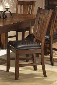 This sleek faux leather chair tones beautifully with dark oak and wood tables. Dark Oak Finish Casual Dining Table W Optional Chairs