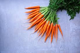 farm fresh carrots with green leaves