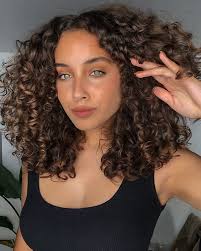 Medium length hair with curls this is a classic curly hairstyle for over 50 if you have naturally beautiful and nicely shaped curls as it would be a complete waste to hide them. 20 Medium Curly Hairstyles That Reveal Your Natural Beauty Medium Hairstyles Haircuts