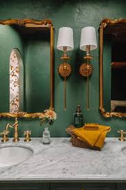 A Dark Green Bathroom With Unexpected
