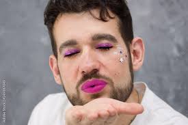 eye makeup and purple lips stock photo