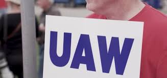 uaw claims gm violated new contract due