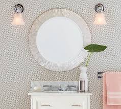 I created a pottery barn inspired mirror using dollar tree mirrors. Miranda Capiz Round Wall Mirror Pottery Barn