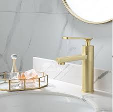 brassed gold widespread bathroom faucet