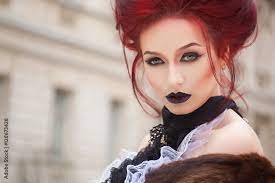 y woman with gothic makeup and red