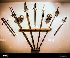 Medieval armor and swords and weapons on a wall display in Fussen, Southern  Germany Stock Photo - Alamy