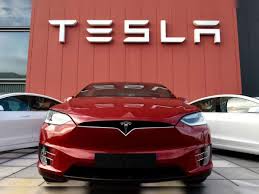 tesla shares rise in busy trade ahead