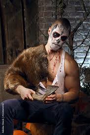 male in sugar skull makeup with axe