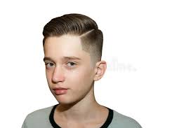 Also known as a medium because the mid taper fade offers a more gradual blending of the hair, it's perfect for men who want. Stylish Modern Retro Haircut Side Part With Mid Fade With Parting Of A School Boy Guy In A Barbershop On A Brown Background Stock Photo Image Of Cheerful Haircut 161348360