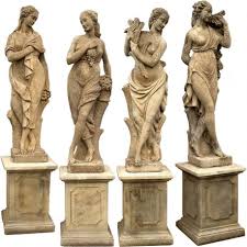 four garden statues with bases four