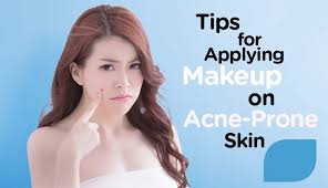 applying makeup on acne e skin