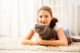 the is huging her cat they are