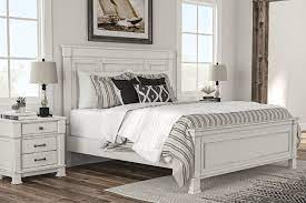 This charmond collection features classic traditional styling with an ornate flavor with a sophisticated dark brown oak finish touched with a white glazed accent. Jennily Queen Panel Bed Ashley Furniture Homestore