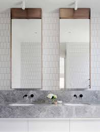 The mirror has a square shape with a thin black frame. 17 Fresh Inspiring Bathroom Mirror Ideas To Shake Up Your Morning Lipstick Routine