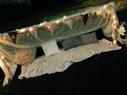 Romantic Picnic Area With Fairy Lights Cushions And