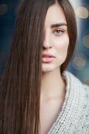 Beautifully written and resonates with me so deeply, growing up in a society where everybody wants to have blonde hair and blue eyes, its only at the age of 20, i've truly learned to embrace my heritage. Young Beautiful Woman With Blue Eyes And Long Brown Hair Covering Half Face By Maja Topcagic Stocksy United