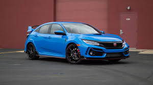 You'll recognize it by its body color grille accents, a bigger grille opening and a little less mesh over some of the fake vents. 2020 Honda Civic Type R Review Better Living Through Technology Roadshow
