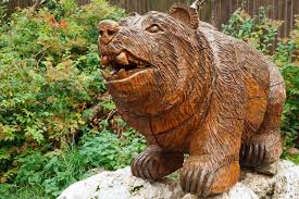 Wooden Bear Sculpture In A Garden Free