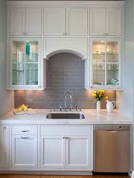 Grey Subway Tile Against White Cabinets