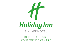 Business guests enjoy the breakfast. Holiday Inn Berlin Airport Conference Centre Karrieretag