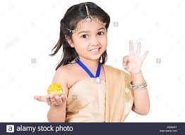 1 Indian Kid Girl Diwali Festival Palm Sweets Laddu Showing