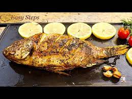 cook oven roasted a whole tilapia fish