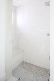 white grid shower wall tiles with gray